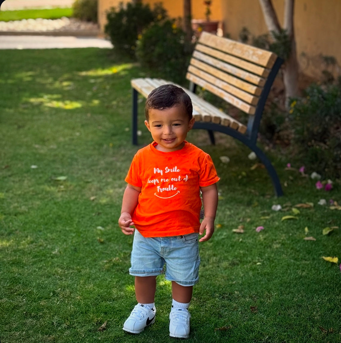 My smile keeps me out of trouble Tshirt